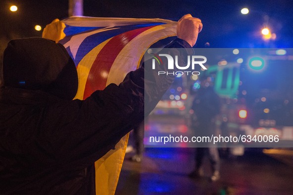 Protester is seen showing Catalan independence flag to police.
Close to the elections of the Generalitat of Catalonia, the Spanish extreme r...