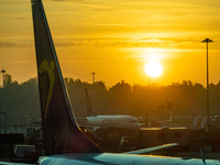 Early morning magic hour sunrise scenery in London Stansted STN EGSS airport, with aircraft of Ryanair FR RYR  Irish low-cost carrier, Boein...