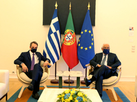 Portuguese Prime Minister Antonio Costa (R ) poses for a photo with his Greek counterpart Kyriakos Mitsotakis ahead their meeting at the Sao...