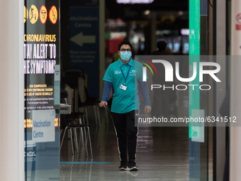 Medical staff are seen at NHS Nightingale hospital at the ExCeL exhibition centre, which re-opens today as a mass vaccination centre on 11 J...
