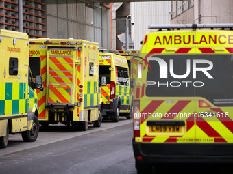 Ambulances wait outside the emergency department of the Royal London Hospital in London, England, on January 11, 2021. Mayor of London Sadiq...