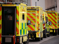 Ambulances wait outside the emergency department of the Royal London Hospital in London, England, on January 11, 2021. Mayor of London Sadiq...