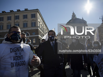  League party leader Matteo Salvini (C) walks as he meets protesters during a demonstration by tourist agencies, operators and guides at Pia...