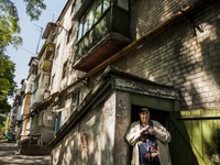 Ilyana lives in a basement shelter under a building for almost one year in a dangerous district close to the Donetsk airport shelled by ukra...