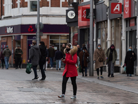 Residents of Wandsworth are seen running their daily errands as England is under third lockdown to limit the spread of the new, more infecti...