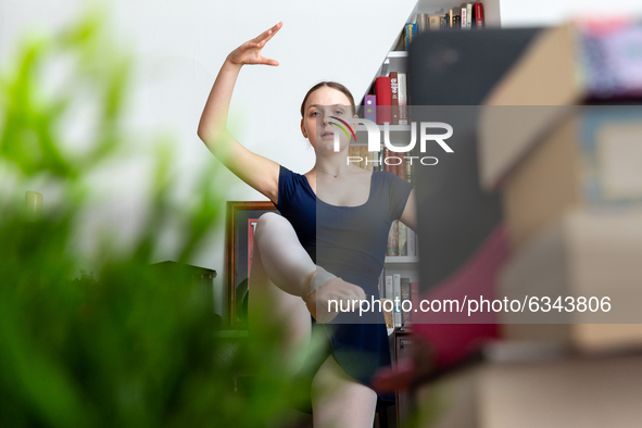 Fourteen years old Gabi attends her ballet class run online by her instructor from Central School of Ballet in London, England on January 11...