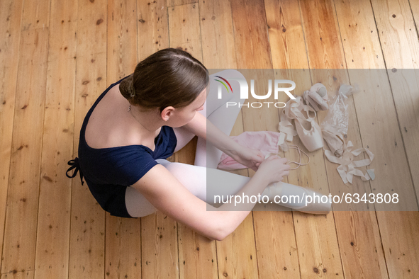 Fourteen years old Gabi attends her ballet class run online by her instructor from Central School of Ballet in London, England on January 11...