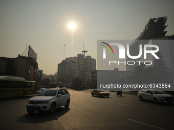 A view of a square in northern Tehran during a polluted air, following the COVID-19 outbreak in Iran, on January 12, 2021. Tehran is wedged...