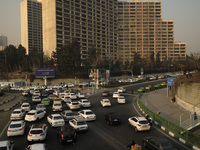 Vehicles travel on a road in northwestern Tehran during a polluted air, following the COVID-19 outbreak in Iran, on January 12, 2021. Tehran...