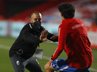 A physical trainer works with Jesus Vallejo, of Granada CF during the La Liga match between Granada CF and C.A. Osasuna at Nuevo Los Carmene...