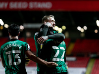 Kwadwo Baah of Rochdale in a hug with his teammates Stephen Humphrys after scoring his side third goal during the Sky Bet League 1 match bet...