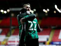 Kwadwo Baah of Rochdale in a hug with his teammate Stephen Humphrys after scoring his side third goal during the Sky Bet League 1 match betw...