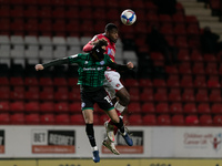 Ollie Rathbone of Rochdale and Chuks Aneke of Charlton compete for the ball during the Sky Bet League 1 match between Charlton Athletic and...