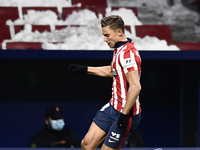 Marcos Llorente of Atletico Madrid runs with the ball with the snowy stands during the La Liga Santander match between Atletico de Madrid an...