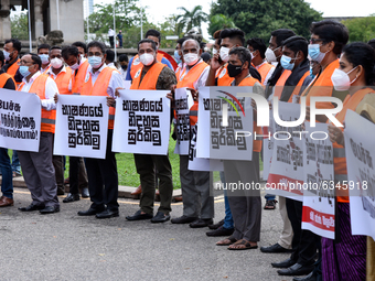 Sri Lankan Opposition supporters hold placards  during a protest against individuals being arrested for hate speech against President Gotaba...
