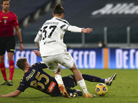 Nicol Rovella of Genoa CFC and Radu Dragusin of Juventus FC compete for the ball during the Italy Cup match between Juventus FC and Genoa CF...