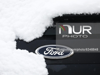 Ford car emblem is covered with snow in Krakow, Poland. January 14, 2021. (