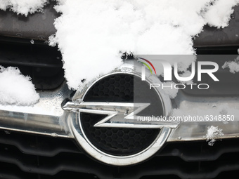 Opel car emblem is covered with snow in Krakow, Poland. January 14, 2021. (