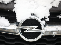 Opel car emblem is covered with snow in Krakow, Poland. January 14, 2021. (