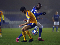  Mansfields Ryan Sweeney tangles with Oldhams Dylan Bahamboula during the Sky Bet League 2 match between Oldham Athletic and Mansfield Town...