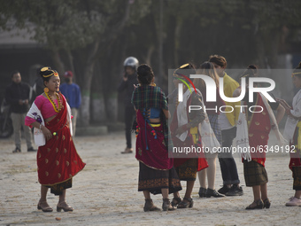 Nepalese Magar community girls in a traditional attire dancing during Maghi festival or the New Year of the Magar community, due to covid 19...