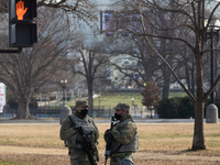 Members of the National Guard gather at the US Capitol a day after The House of Representatives impeached President Trump for inciting an in...