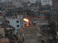 People celebrate Sakrain festival on their roof tops in Dhaka, Bangladesh on January 14, 2021. (