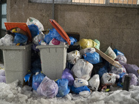 Accumulated garbage is seen in the streets of Madrid due to the snow caused by storm Filomena on January 14, 2021 in Madrid, Spain. (