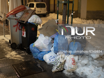 Accumulated garbage is seen in the streets of Madrid due to the snow caused by storm Filomena on January 14, 2021 in Madrid, Spain. (