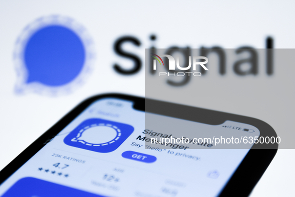 Signal logo on the AppStore displayed on a phone screen and Signal logo in the background are seen in this illustration photo taken in Polan...