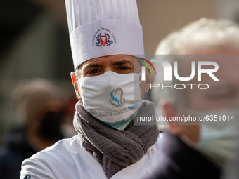 Bars and restaurants owners protest against the new coronavirus restrictions, in Brescia, Italy, on January 15, 2021. (