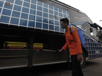 An Indonesian rescue team sprays disinfectant around Bogor's bus station as a preventive measures against  Covid-19 novel coronavirus, in Bo...