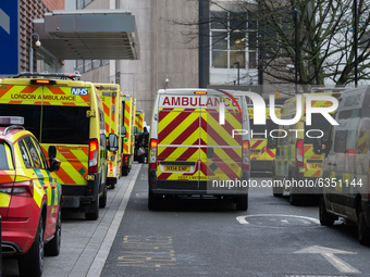 Ambulances are seen parked outside the emergency department of the Royal London Hospital, on 15 January, 2021 in London, England. Hospitals...