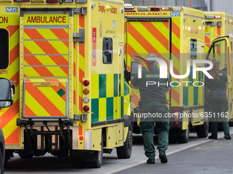 Paramedics stand next to the ambulances outside the emergency department at the Royal London Hospital, on 15 January, 2021 in London, Englan...