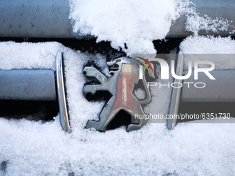 Peugeot car emblem is covered with snow in Krakow, Poland. January 15, 2021. (