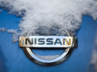 Nissan car emblem is covered with snow in Krakow, Poland. January 15, 2021. (