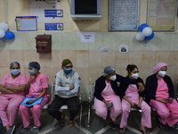 Health workers awaits for the Coronavirus vaccination in Kolkata, India, on January 16, 2021 (