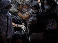 Funeral ceremony for the victims of Sriwijaya Air SJ 182 plane crash at a public cemetery at Pondok Petir Cemetery, in Depok, Indonesia, on...