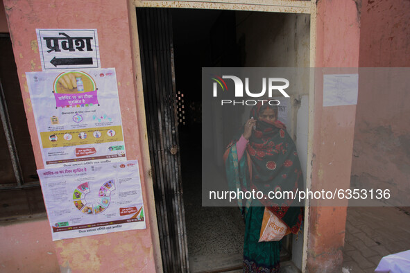 A health worker woman comes out after get vaccinated,  at a hospital  in the outskirts of Allahabad on January 16,2021.India started inocula...