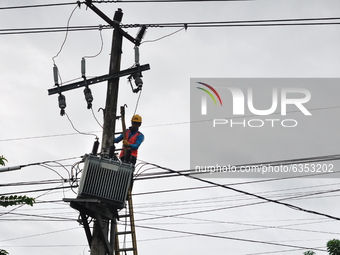 A worker is repairing electricity in Mamuju Regency, West Sulawesi, on Saturday, January 16, 2021. The power outage was caused by the shock...