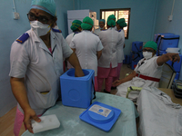 Medical staff members prepare to perform a nationwide a vaccination drive against COVID-19 in Mumbai, India on January 16, 2021. (