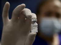 A nurse holds a dose of COVID-19 vaccine at Evangelismos hospital .  In  Athens, on Saturday January 16, 2021 (