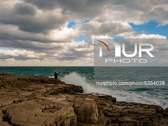 A boy takes some photos with his smartphone of the storm on Lama Monachile in Polignano a Mare on January 16, 2021.
The arrival of the 