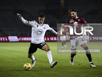 Spezia midfielder Giulio Maggiore (25) fights for the ball against Torino defender Nicola Murru (29) during the Serie A football match n.18...
