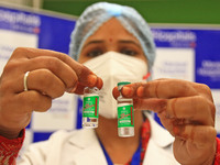 A medic shows  Covishield vaccine vials, after the virtual launch of the COVID-19 vaccination drive by Prime Minister Narendra Modi, at Mani...