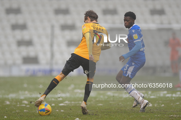 Cambridges Harrison Dunk and Colchesters Kwame Poku during the Sky Bet League 2 match between Colchester United and Cambridge United at the...