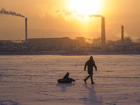 People walk on the ice of the Gulf of Finland. The temperatures have reached minus fifteen degrees Celsius in St. Petersburg, Russia, on Jan...