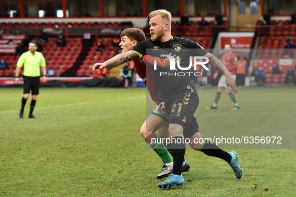 Oldham Athletic's Marcel Hilssner and Alfie Bates of Walsall  during the Sky Bet League 2 match between Walsall and Oldham Athletic at the B...