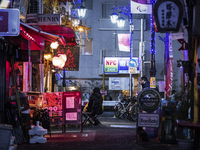 Some opened bars at back alley in nightlife district of Tokyo, 14 January 2021. (