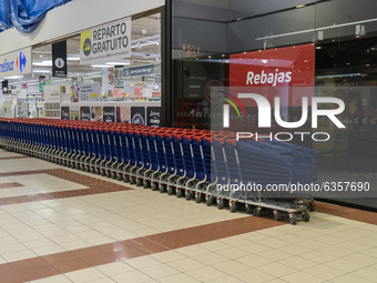 Rows of shopping carts in the Valle Real Shopping Center in Santander, Spain on January 16, 2021 with stores closed due to the entry into fo...